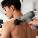 Pistola masajeadora con accesorios