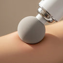 Pistola masajeadora con accesorios